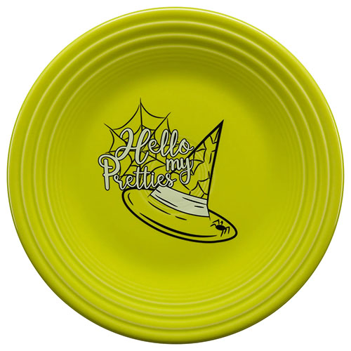 Green plate with witches' hat and the words hello my pretties painted on its face.