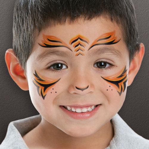 Child with temporary tiger stripe tattoos on face.