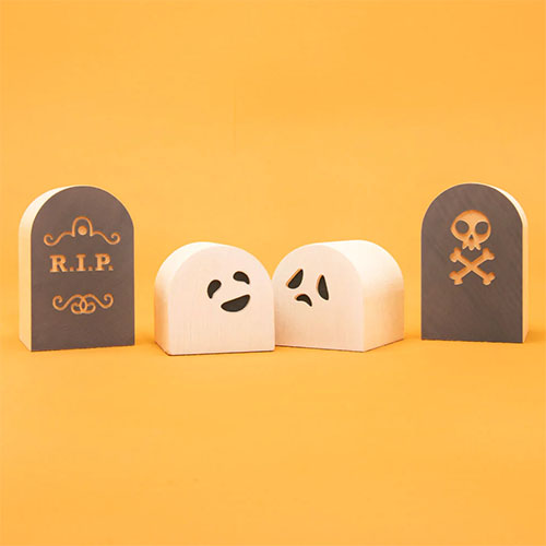 Wooden blocks depicting cute ghosts and gravestones.