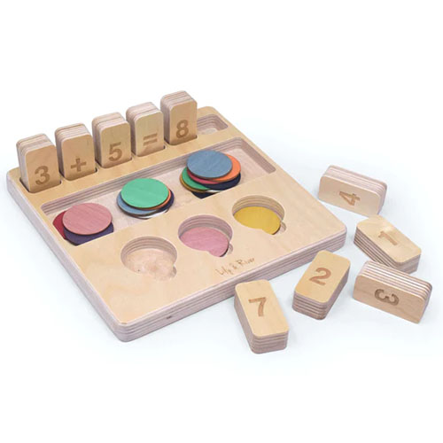 Educational game with wooden blocks and disk for learning math basics.