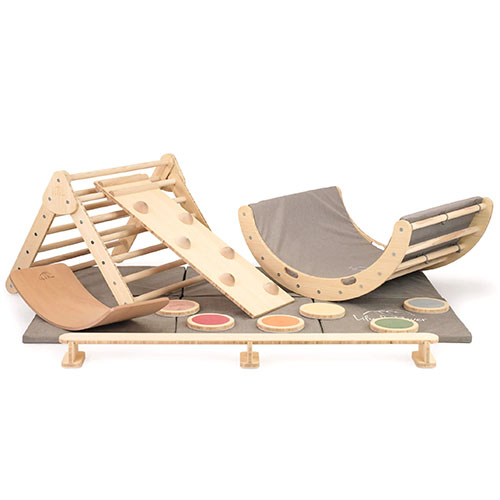 Set of wooden climbing and balancing equipment and toys for kids.