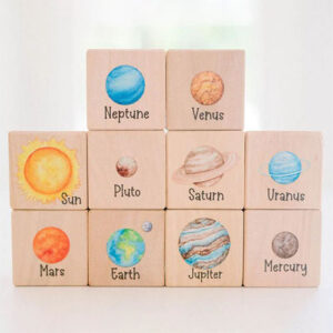 Wooden blocks with planets on them.