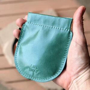 Blue-green leather pinch coin pouch.