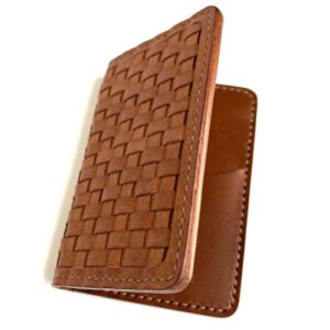 Light brown leather bi-fold wallet with woven exterior.