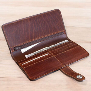 Brown leather clutch wallet with 6 card slots, 3 cash pockets and 1 zip pocket from Buffalo Billfold.