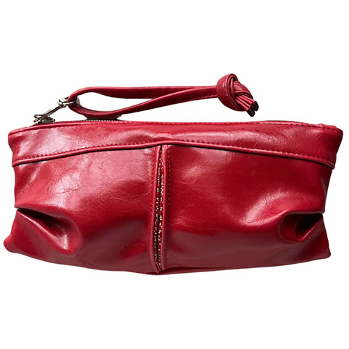 Large red pleated clutch made from vegan leather by Crystalyn Kae.