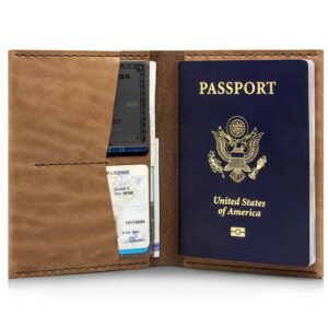 Brown leather passport wallet by Ezra Arthur.