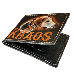 Black leather bifold wallet with dog image and name carved into it.