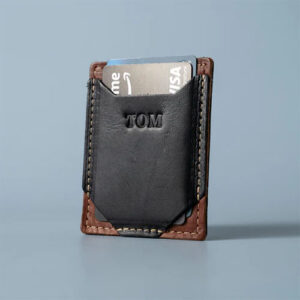 Card case in black and brown leather by Holtz Leather.