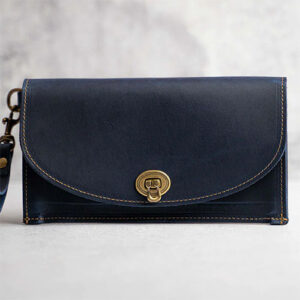 Dark blue leather clutch wallet with wrist band by Holtz Leather.