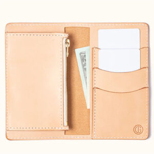 Natural leather womens wallet by Tanner Goods with 3 card slots, 3 cash slots and 1 zipper pocket.
