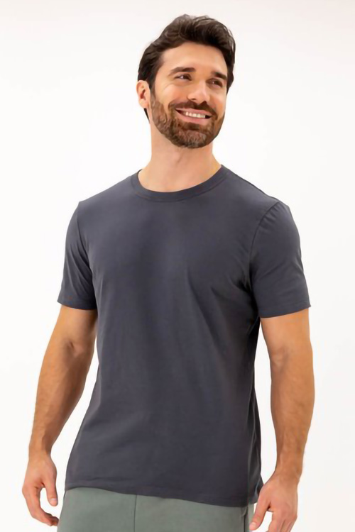 Smiling man wearing dark grey t-shirt.