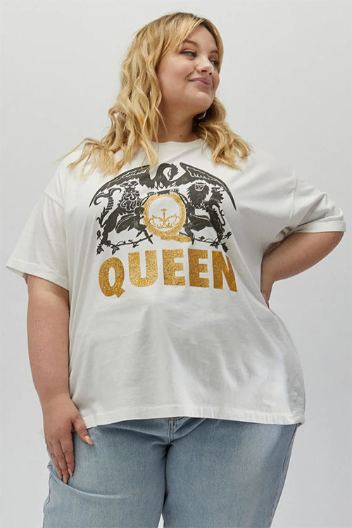 Big girl wearing white t-shirt with Queen band name and logo.