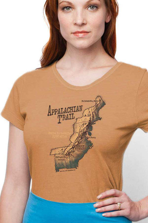Woman wearing orange-brown v-neck t-shirt with map of Appalachian Trail printed on the chest.