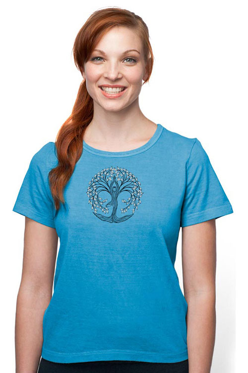 Woman wearing light blue crew-neck t-shirt with tree of life printed on the chest.