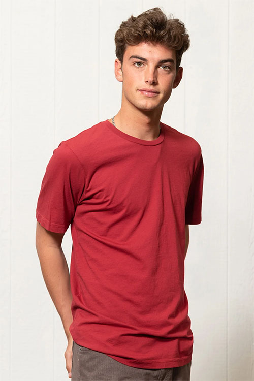 Young man wearing red crew-neck t-shirt.