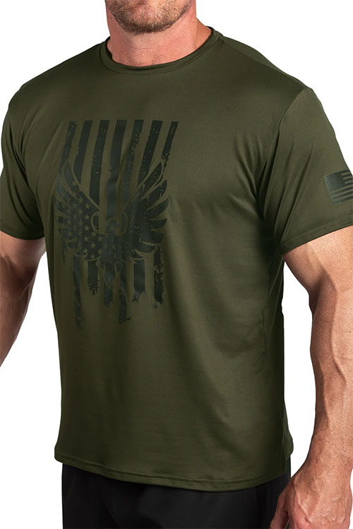 Man wearing olive green t-shirt with black American flag and eagle.