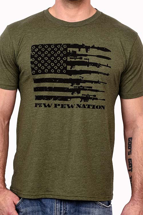 Man wearing army green t-shirt with American flag made out of firearms on the chest with the words 'pew pew nation'.