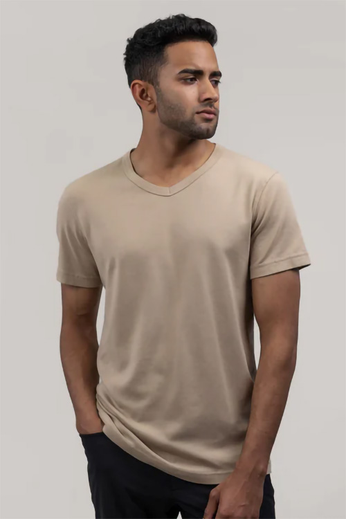 Man wearing beige v-neck  t-shirt.
