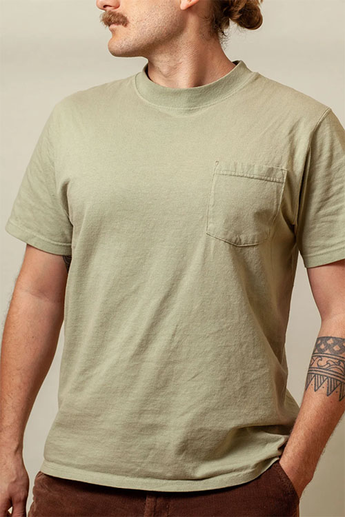 Man wearing light-green crew-neck t-shirt with front pocket.