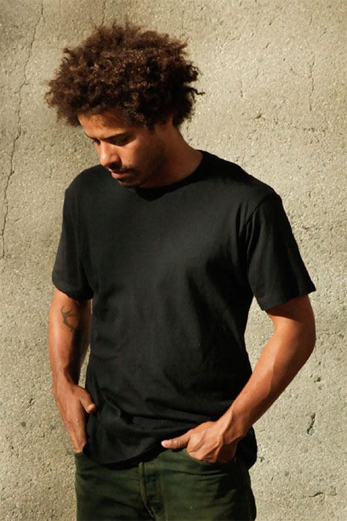 Man wearing black short sleeve t-shirt.