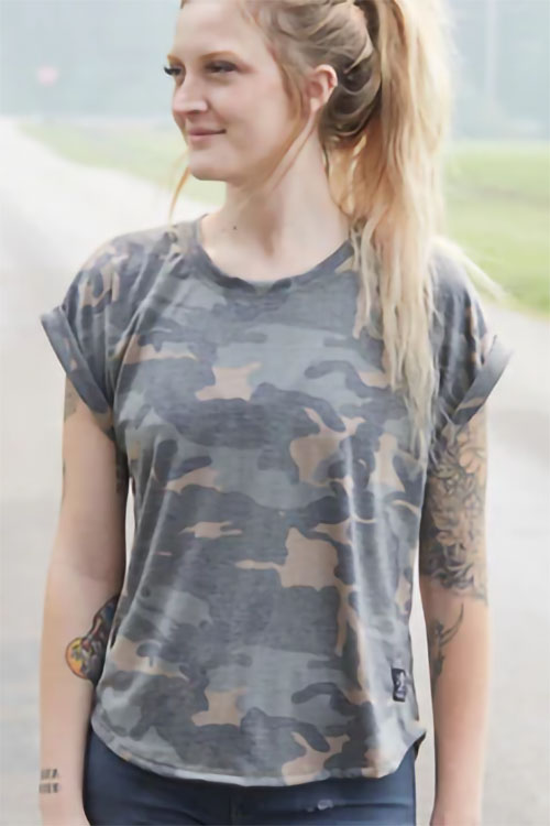 Young woman wearing muscle tee with camouflage pattern.