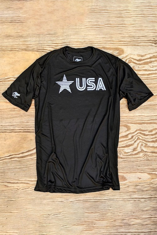 Black athletic crew-neck t-shirt with short sleeves and the word USA printed in white on the chest next to a star.