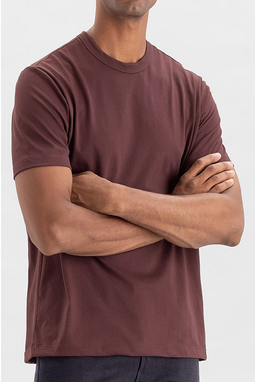 Man wearing wine-red t-shirt with crew-neck.