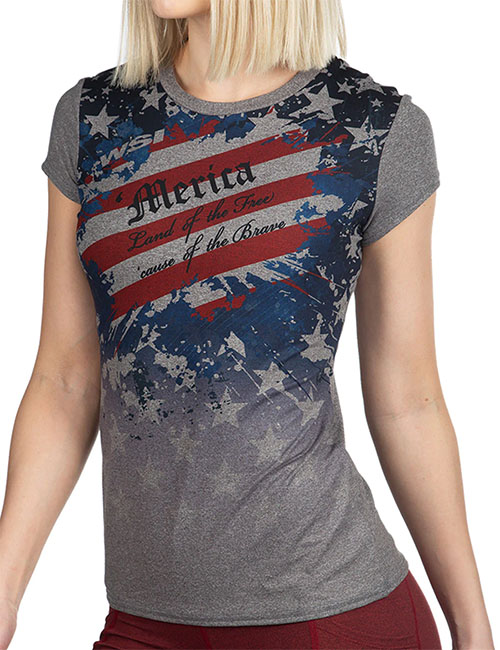 Woman wearing t-shirt with American flag pattern and the words ' Merica, land of the free, cause of the brave' on the chest.