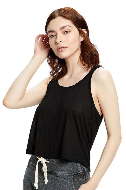 Woman wearing loose black tank top.