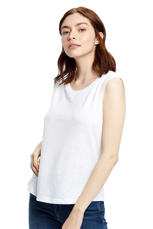 Woman wearing white muscle tank top.