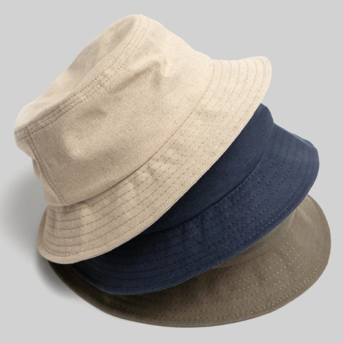 Tower of white, blue and brown-green bucket hats.