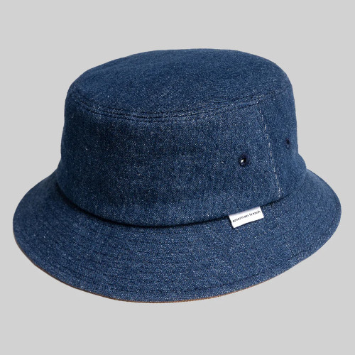 Dark blue denim bucket hat with small vent holes.