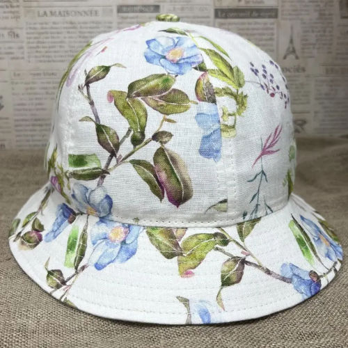 White linen bucket hat with floral print.